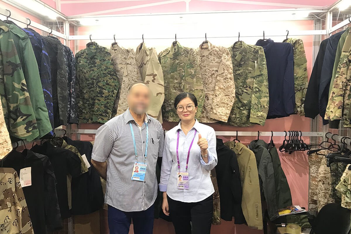Fronter 2017 Canton Fair booth – staff and buyers with camouflage uniforms display