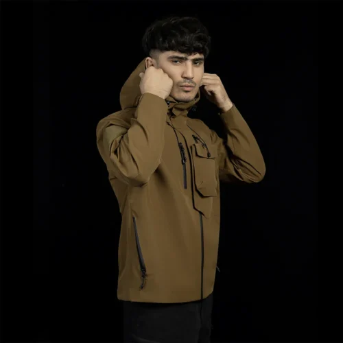 Men’s brown hardshell jacket featuring water-repellent fabric, waterproof zippers, and windproof hood. Perfect for hiking, mountaineering, and outdoor adventures.