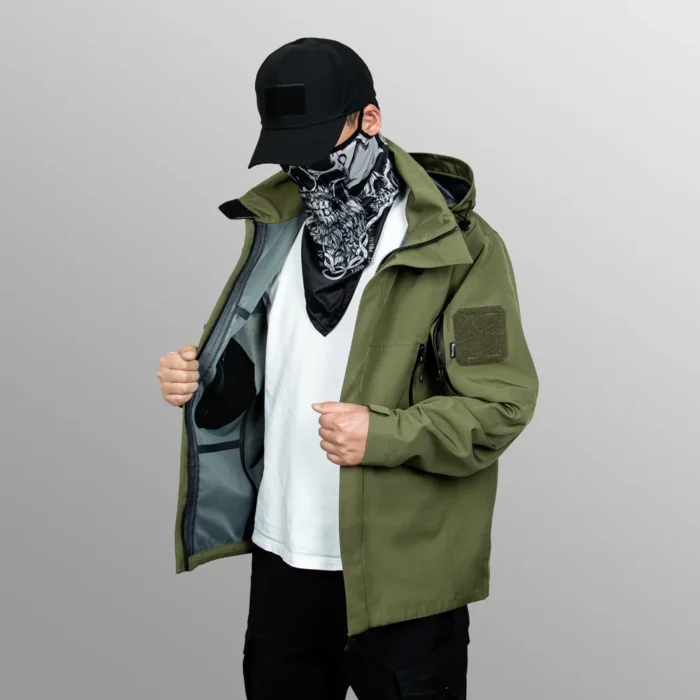 Men’s waterproof jacket in army green shown on model. Lightweight, breathable, and windproof, ideal for hiking, trekking, and daily outdoor use.