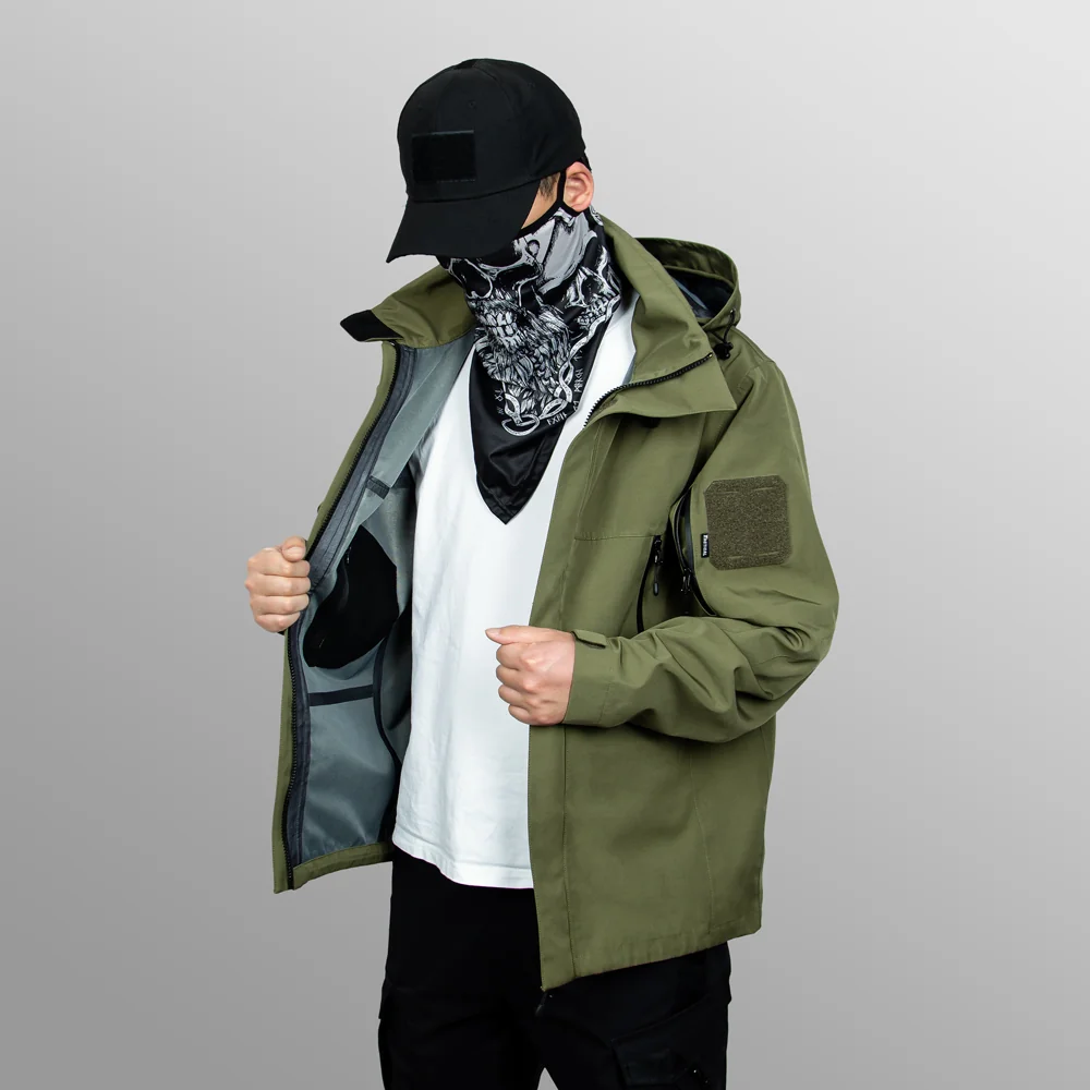 Men’s waterproof jacket in army green shown on model. Lightweight, breathable, and windproof, ideal for hiking, trekking, and daily outdoor use.