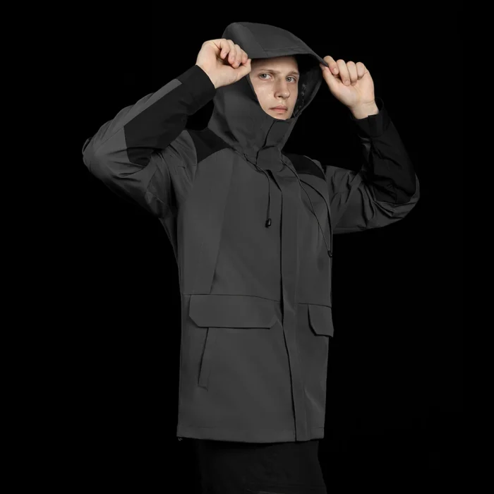 Mens hardshell jacket in grey with adjustable hood. Waterproof and windproof outer shell, ideal for outdoor adventure and daily wear.