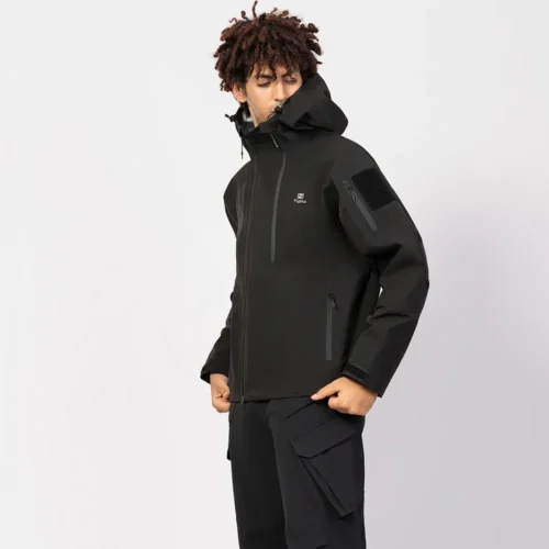 Durable black hardshell jacket with waterproof fabric, breathable lining, and multi-pocket design. Ideal for hiking, camping, and outdoor adventures.