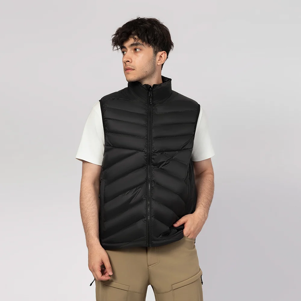 Men’s black down vest with full-zip front and quilted design. Lightweight, warm, and ideal for layering in cold weather.