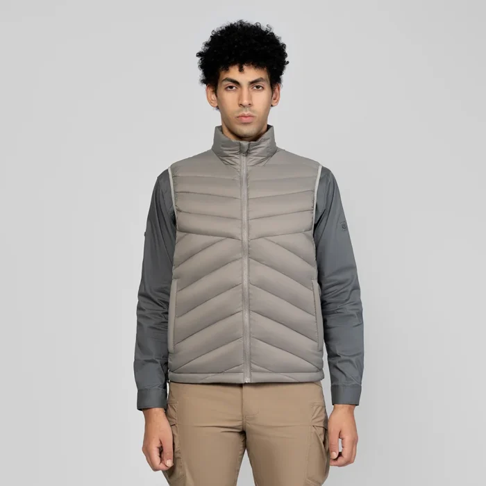 Gray men’s down vest with modern chevron quilting and high collar. Provides excellent insulation and comfort for outdoor use.