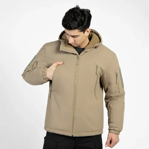 Khaki waterproof winter jacket for men showing chest zipper pocket design. Durable, warm, and ideal for cold-weather work or travel.