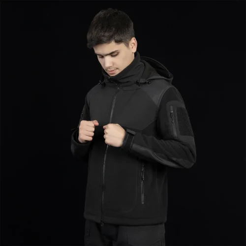 Black polar fleece jacket for men with hood and zip pockets. Windproof, warm, and perfect for tactical and outdoor missions.