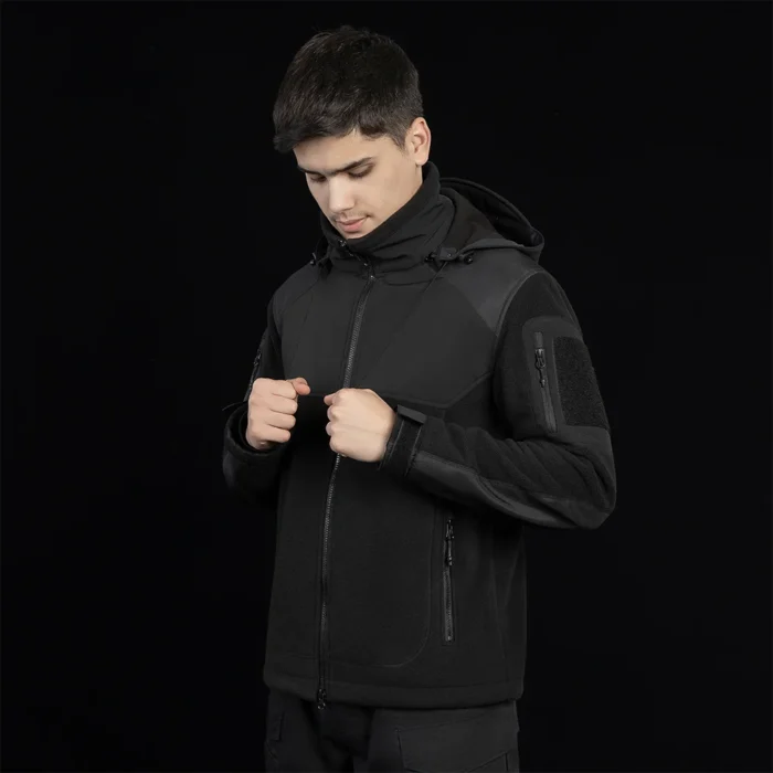 Black polar fleece jacket for men with hood and zip pockets. Windproof, warm, and perfect for tactical and outdoor missions.
