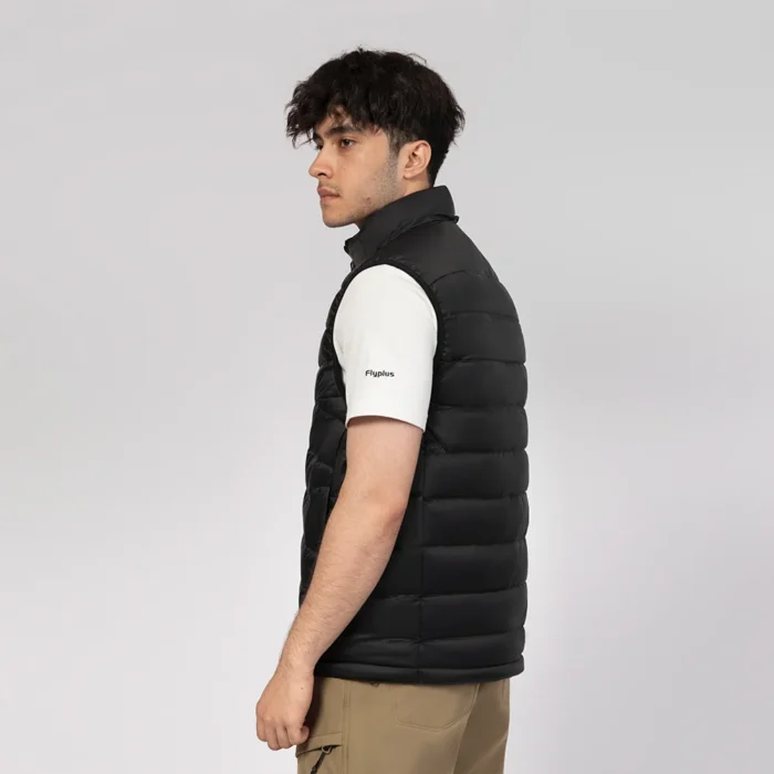 Side profile of men’s black down vest with soft insulation and sleek fit. Lightweight and comfortable for everyday wear.