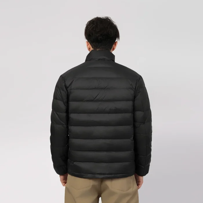 Back view of black lightweight quilted jacket for men. Warm, breathable, and perfect for layering in cold weather.