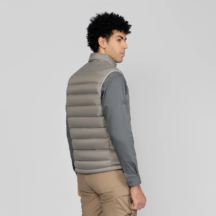 Side view of men’s gray down vest with soft padding and smooth finish. Ideal for layering or casual outdoor outfits.