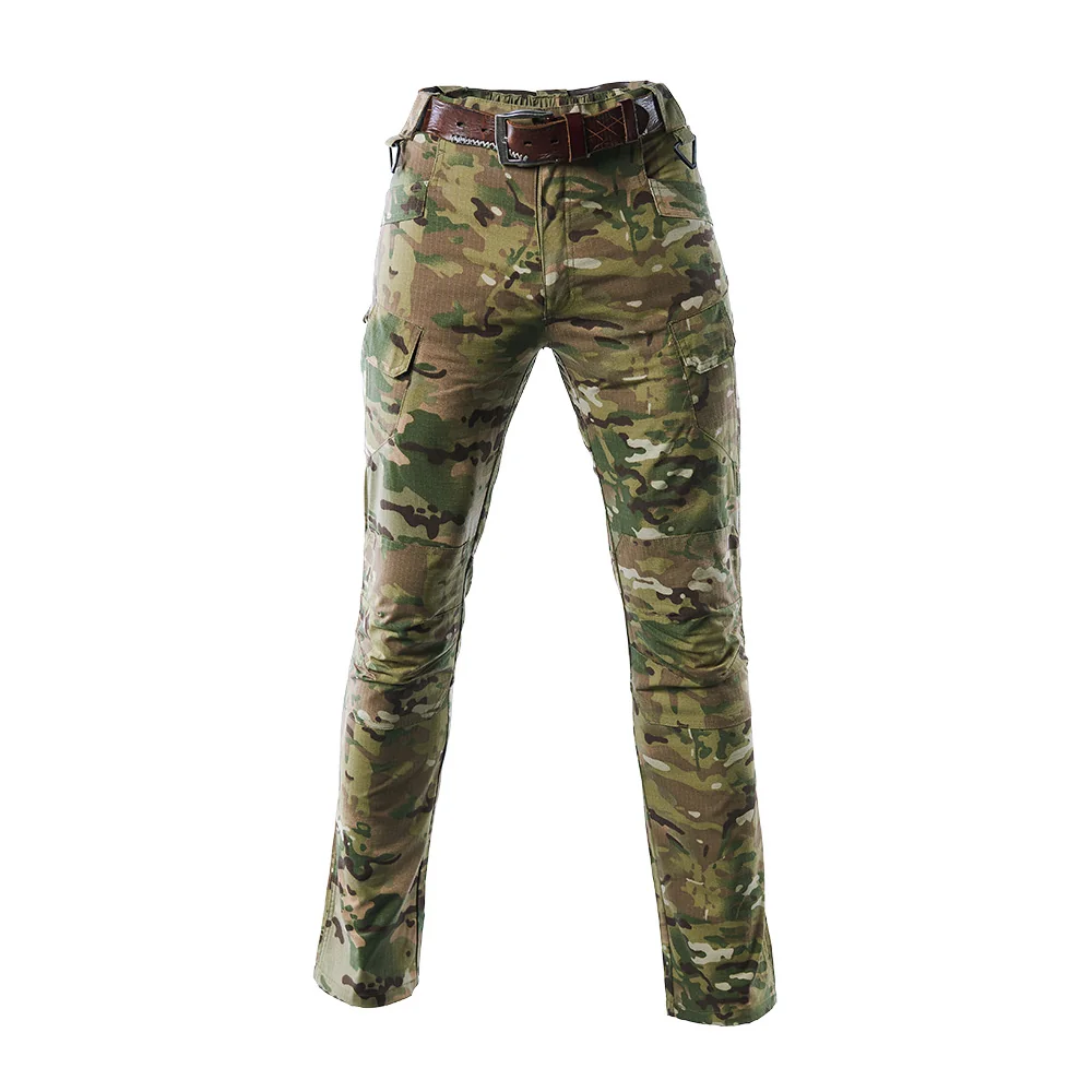 Multicam military tactical pants with adjustable waistband and cargo pockets. Made from polyester-cotton ripstop for flexibility and durability in field operations.