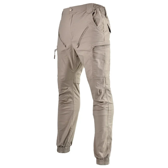 Khaki outdoor pants with zip pockets and ergonomic design. Breathable and stretchable for comfort during hiking or outdoor adventures.