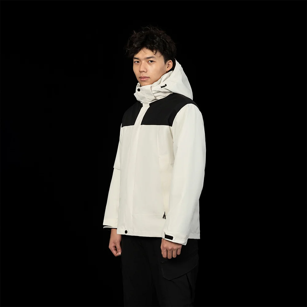 White men’s 3 in 1 waterproof jacket modeled with hooded design and dual-layer construction. Ideal for hiking, camping, and winter travel.