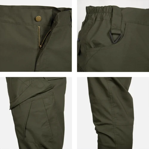 Close-up view of hiking pants showing zipper fly, D-ring design, and reinforced knee stitching for heavy-duty outdoor performance.