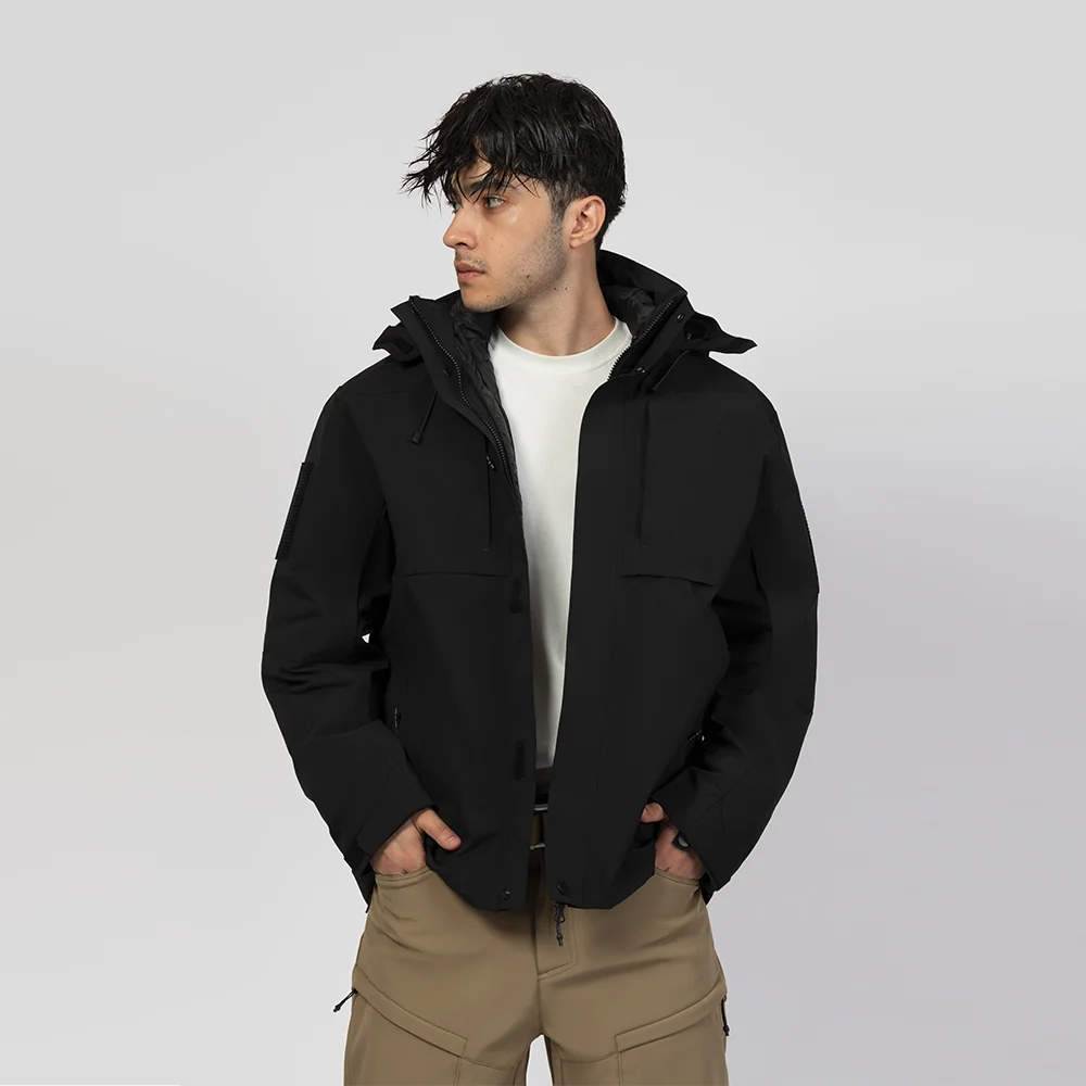 Model wearing classic black 3 in 1 waterproof jacket featuring a removable fleece liner and durable weatherproof shell. Designed for outdoor work and travel.