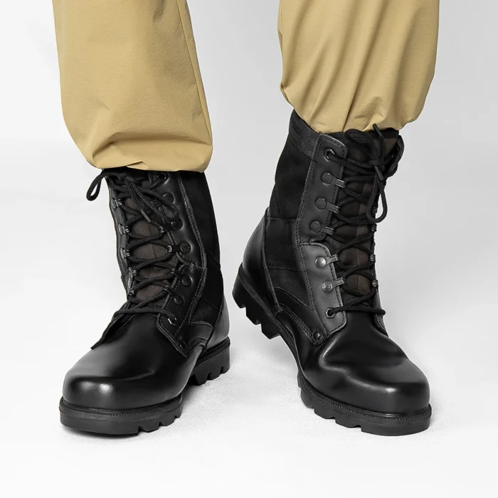 Black Leather Military Boots – Field-Ready Tactical Footwear Model wearing black leather military boots with sturdy sole and lace system, designed for military training and outdoor activities.