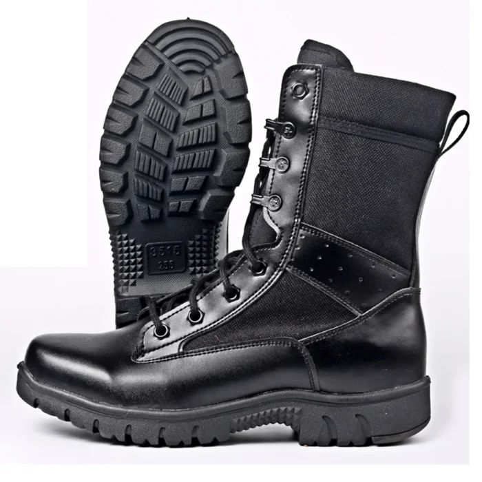 Display of black combat boots showing rugged sole and reinforced stitching, built for durability and traction in tough environments.