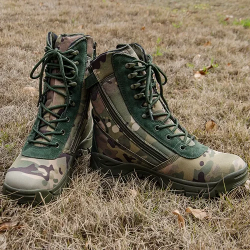 Pair of army military boots featuring camouflage fabric, suede reinforcements, and shock-absorbing rubber outsole for field operations.