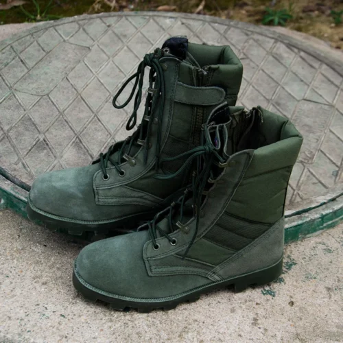 Side view of green military boots shoes with heavy-duty sole and breathable upper, ideal for soldiers and field operators.
