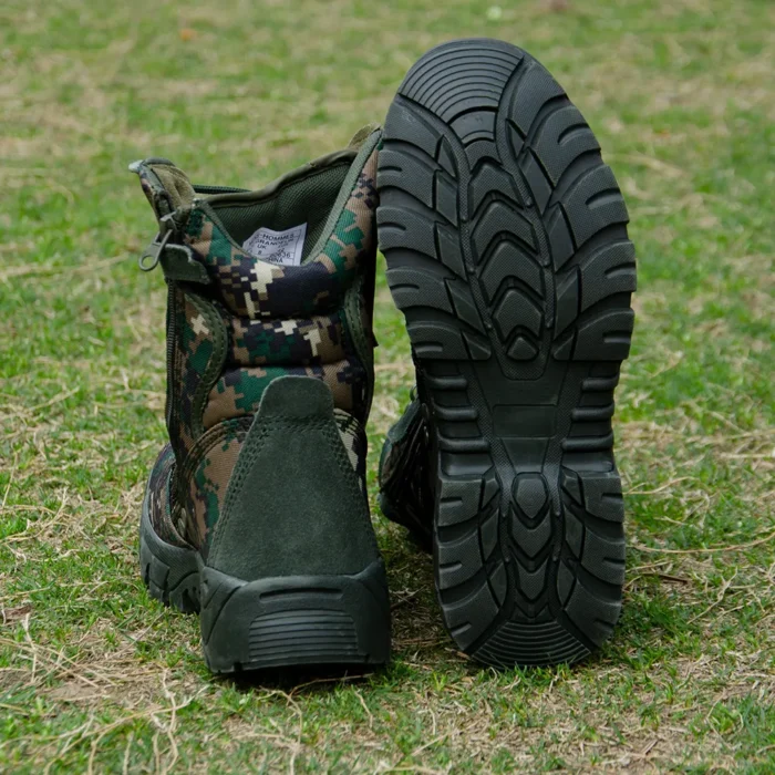Rear and outsole view of army combat boots showing deep tread pattern and reinforced heel for superior traction and stability on rough terrain.