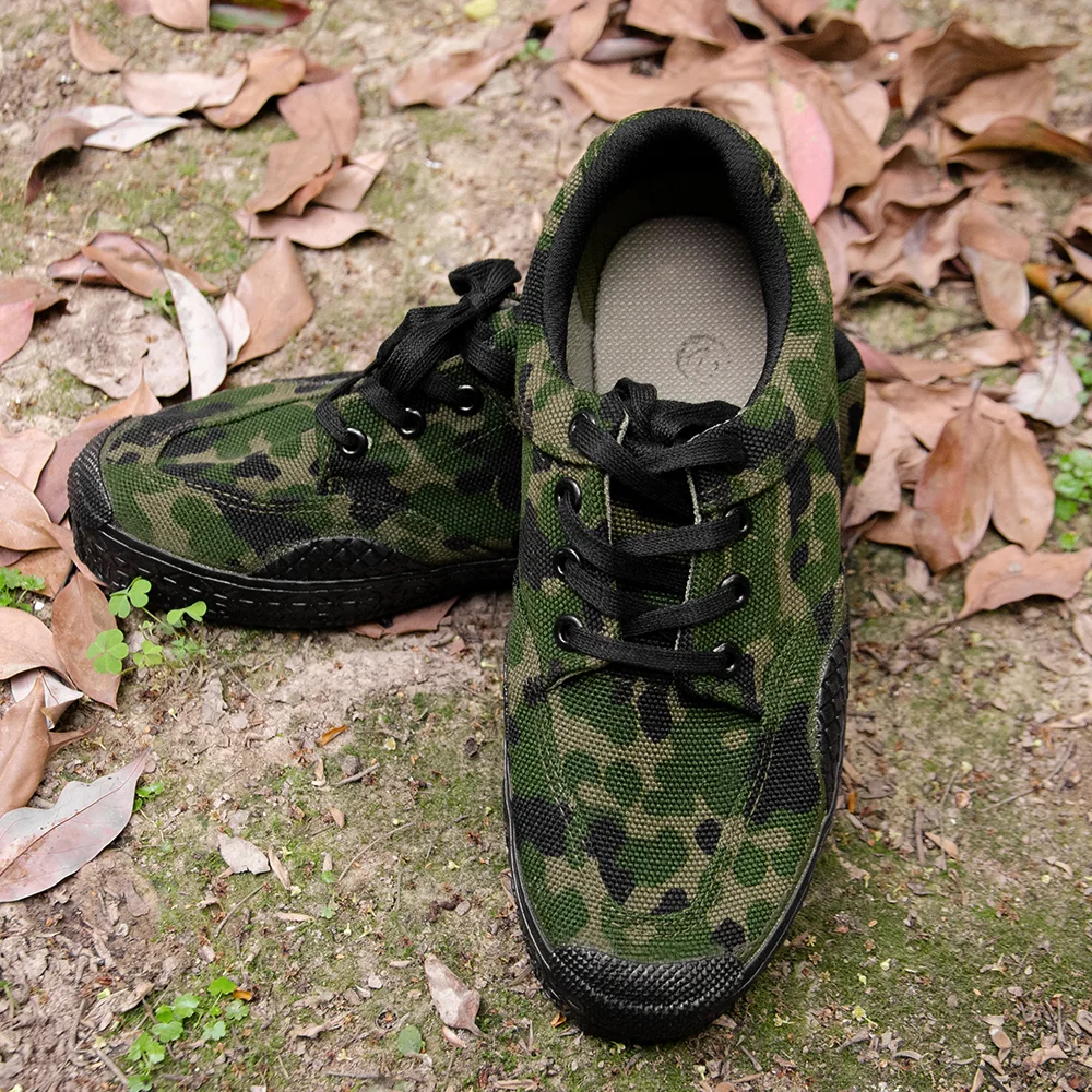 Pair of camouflage training shoes with lace-up design and durable canvas upper, ideal for military drills and outdoor activities.