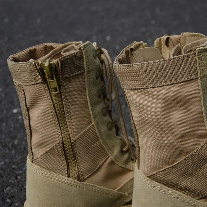 Close-up of army combat boots showing YKK zipper, lace hooks, and reinforced stitching for enhanced durability and comfort.