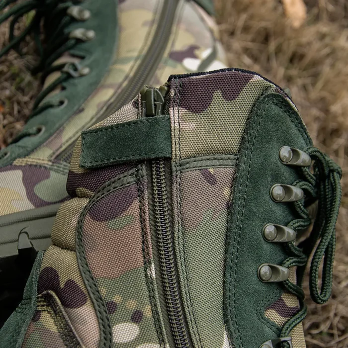 Close-up view of army military boots showing reinforced zipper and lace system for quick wear and reliable support in the field.