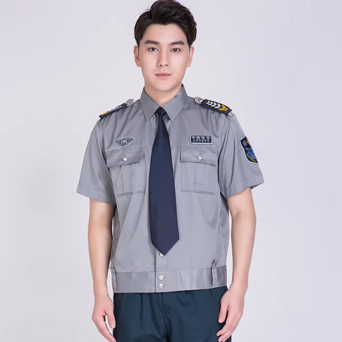 Short-sleeve gray security uniform shirt with epaulets, chest pockets, and professional duty design.