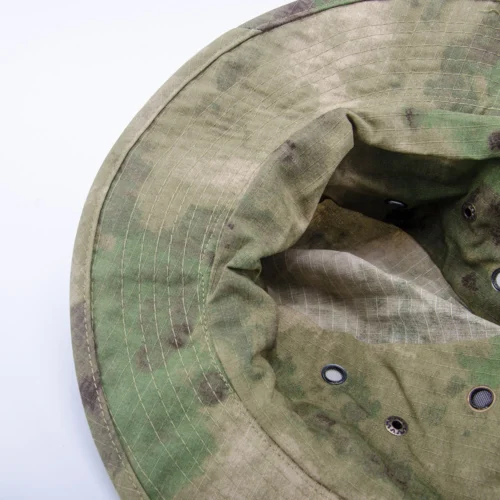 Close-up interior view of an LCP camo boonie hat showing reinforced stitching and ventilation eyelets. Designed for military units and outdoor gear brands.
