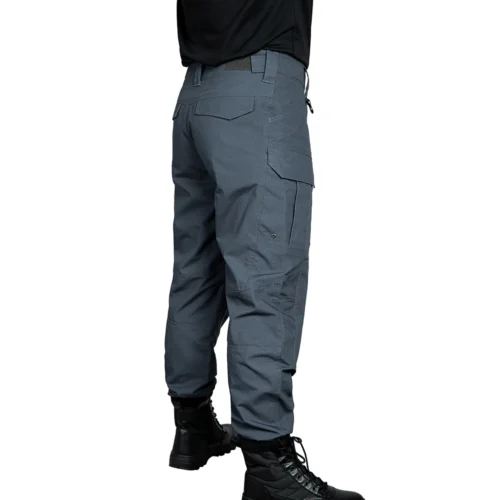 Grey tactical work pants shown from a rear angled view, highlighting reinforced seat area and balanced structure for long-term wear.