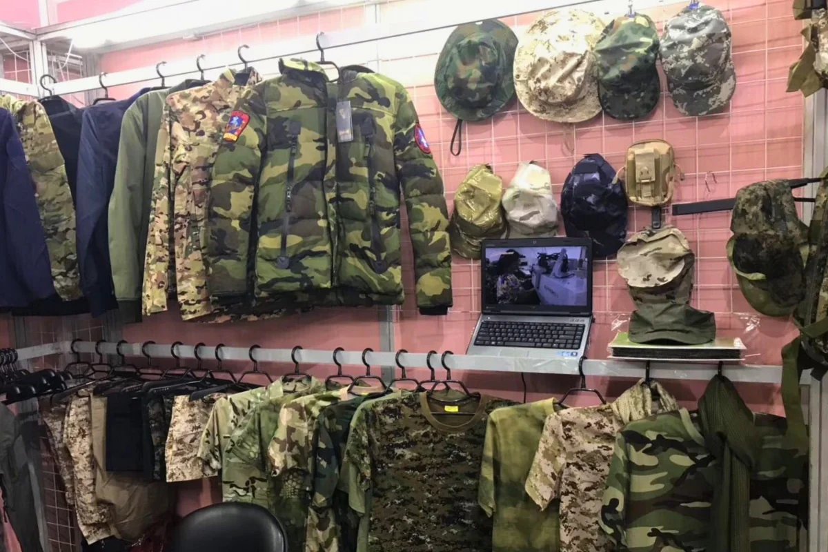 Tactical jackets and camouflage apparel OEM display by WHfronter at Canton Fair
