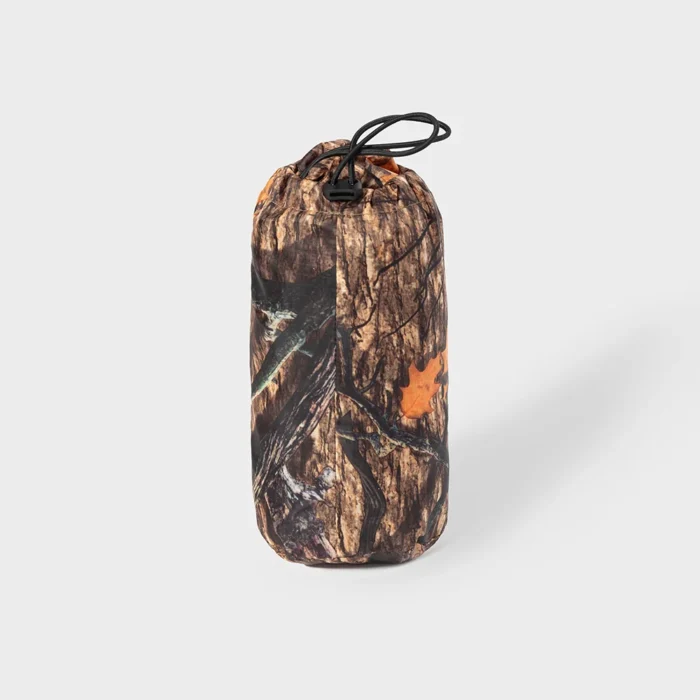 Packable hunting raincoat stored in compact drawstring bag, designed for easy carrying and quick deployment during outdoor hunting and travel.