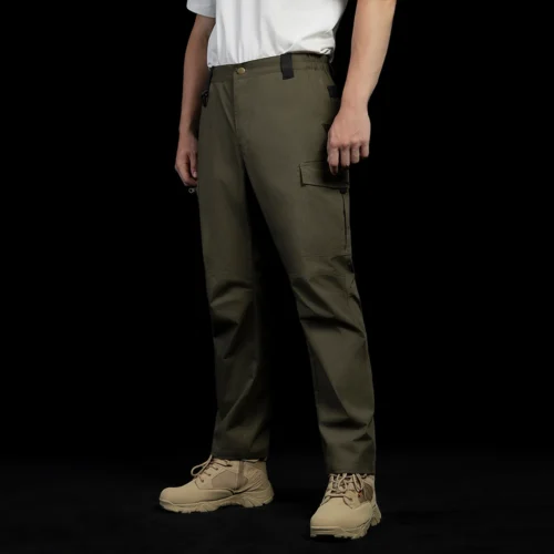 Left angled side view of tactical cargo pants on model, highlighting ergonomic cut, functional cargo pockets, and lightweight tactical construction.