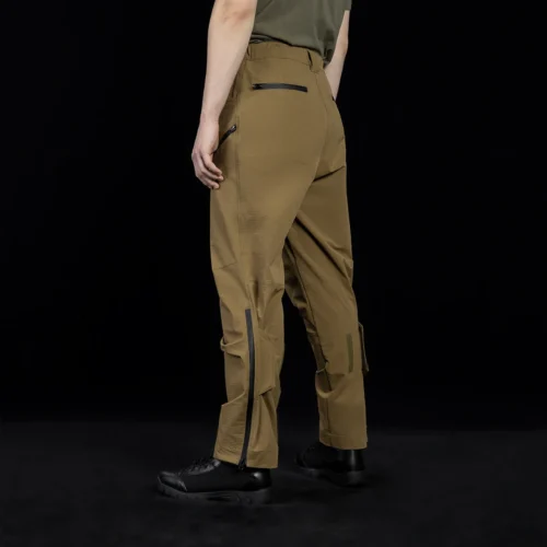 Angled rear side view of outdoor cargo pants showcasing tactical zipper details, reinforced panels, and a performance-driven fit for long-term outdoor wear.