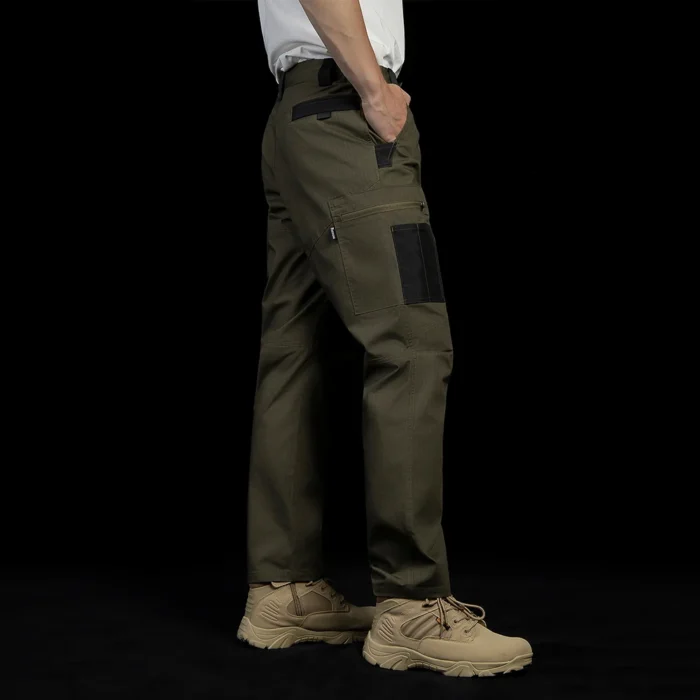 Back side view of tactical cargo pants on model, emphasizing mobility-focused tailoring, reinforced areas, and practical rear pocket placement.