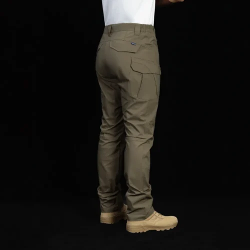 Rear angled view of tactical cargo pants worn by model, highlighting ergonomic fit, reinforced stitching, and functional cargo pocket placement.
