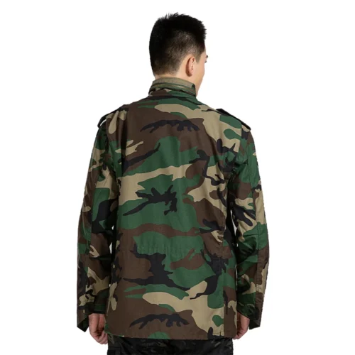 Back view of M65 tactical jacket in woodland camouflage, featuring classic military cut, durable fabric, and full-coverage design for field and tactical use.