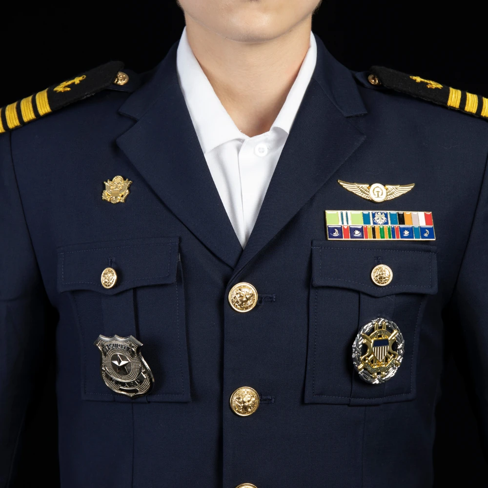 Close-up view of front layout and insignia placement on an officer dress uniform. Supports program customization for badge positioning, stitching methods, and hardware finishing.