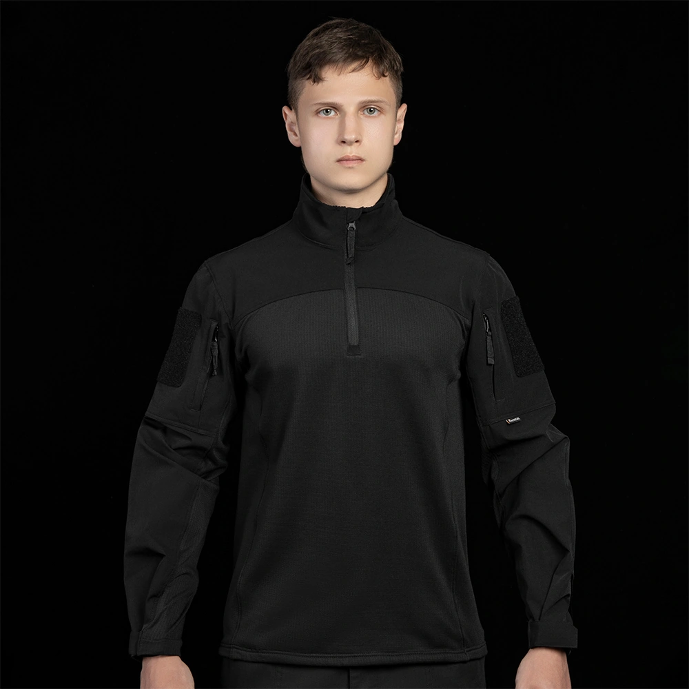 Front view of black tactical training shirt with stand collar and half-zip design. Reference style for OEM combat shirt development, including fabric options, sleeve pocket layout, and ID/patch placement.