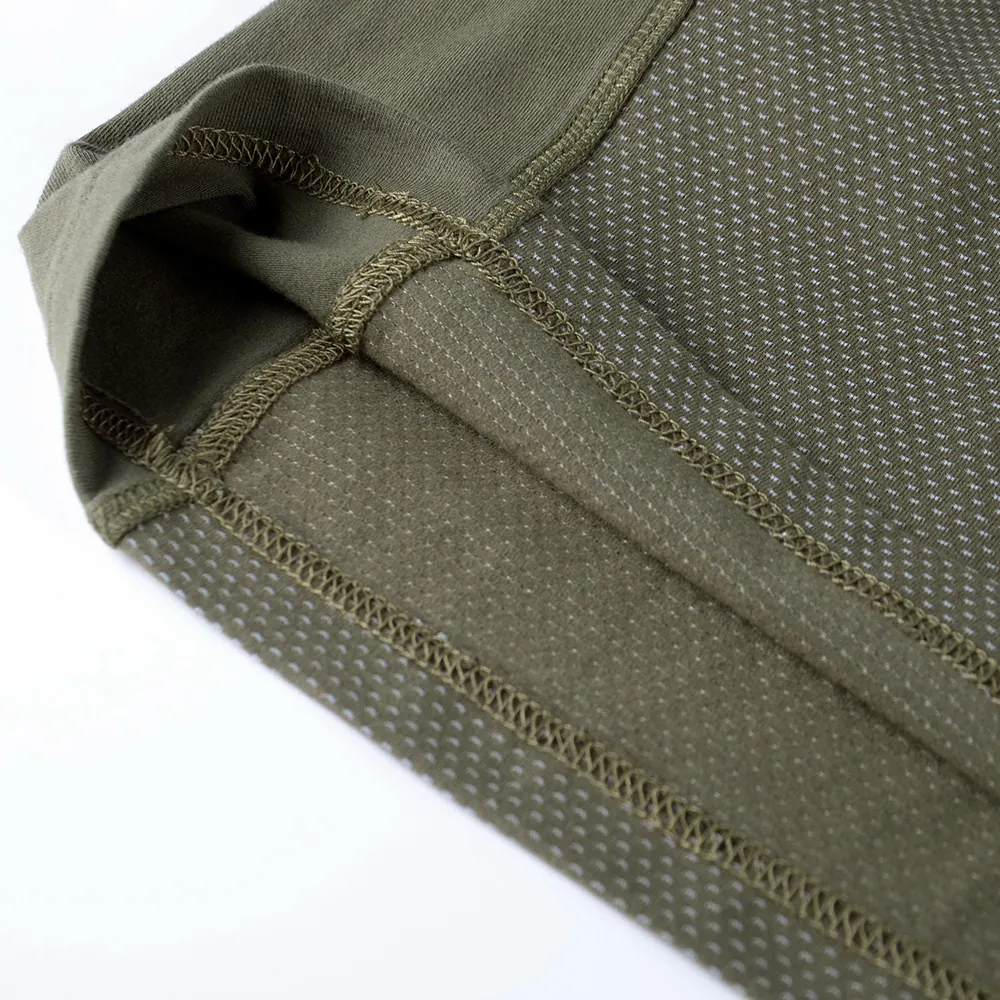 Close-up of knit body hem stitching on a tactical frog shirt, showing stretch panel construction and reinforced seams for OEM uniform programs.