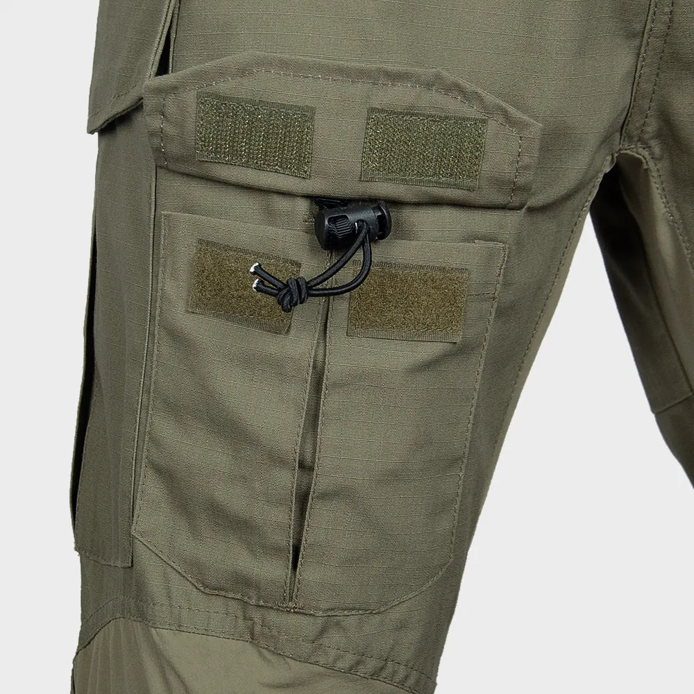 Close-up of thigh cargo pocket construction with hook-and-loop closure and retention cord. Used to review pocket structure, stitch lines, and durability options in bulk programs.
