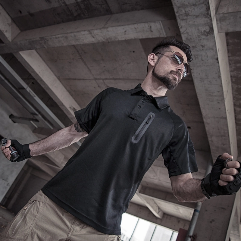 Black tactical quick-dry polo shirt worn in action scene, breathable fabric for duty wear and outdoor teams; OEM customization for branding and sizing.