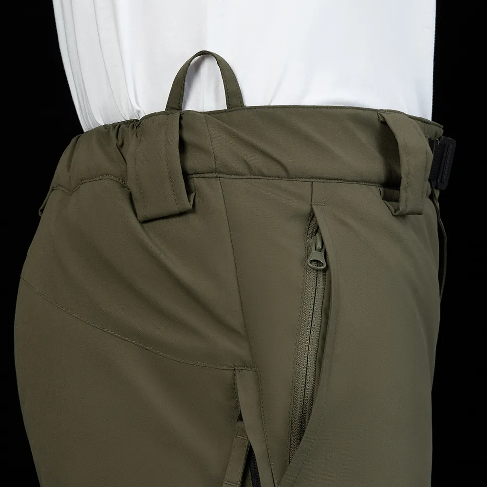 Waist area and zipper pocket detail on insulated pants. Reference for pocket construction, stitching, and functional hardware options in OEM programs.